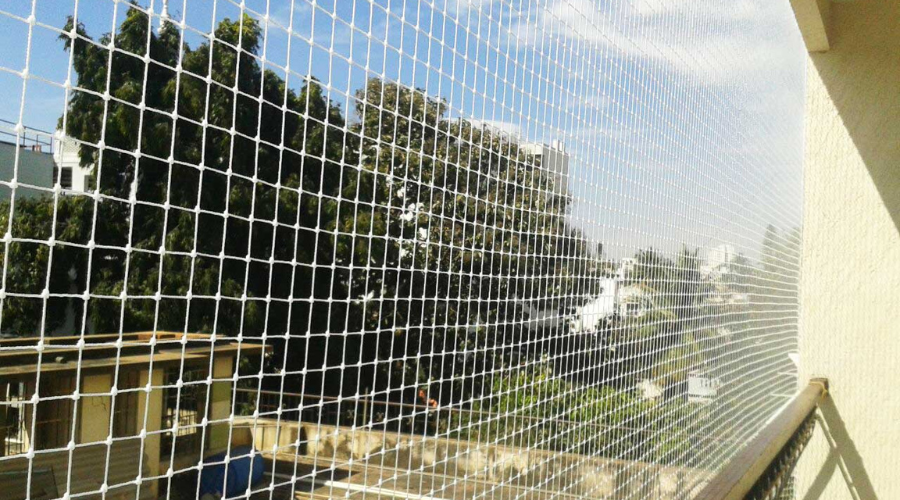 Stainless steel invisible grill for windows showcasing clear view and safety by Hasini Safety Nets
